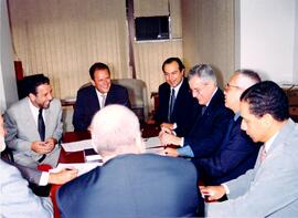 Fotografia de uma reunião realizada pela diretoria da Associação Nacional dos Membros do Ministér...